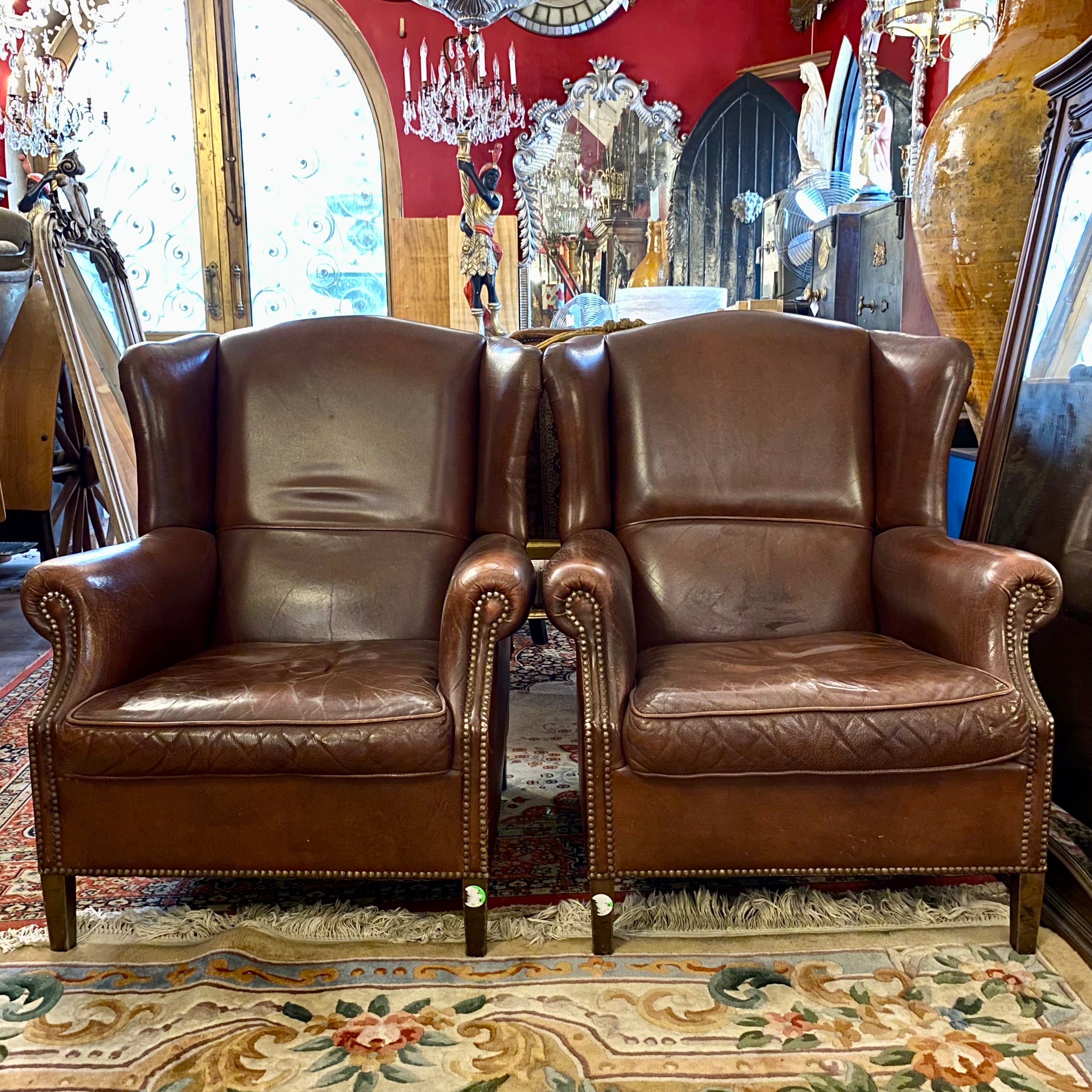 A pair of Dark Leather armchairs