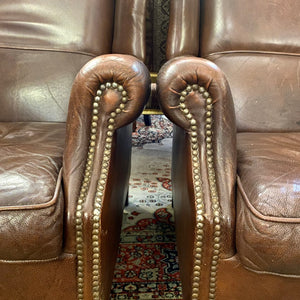 A pair of Dark Leather armchairs