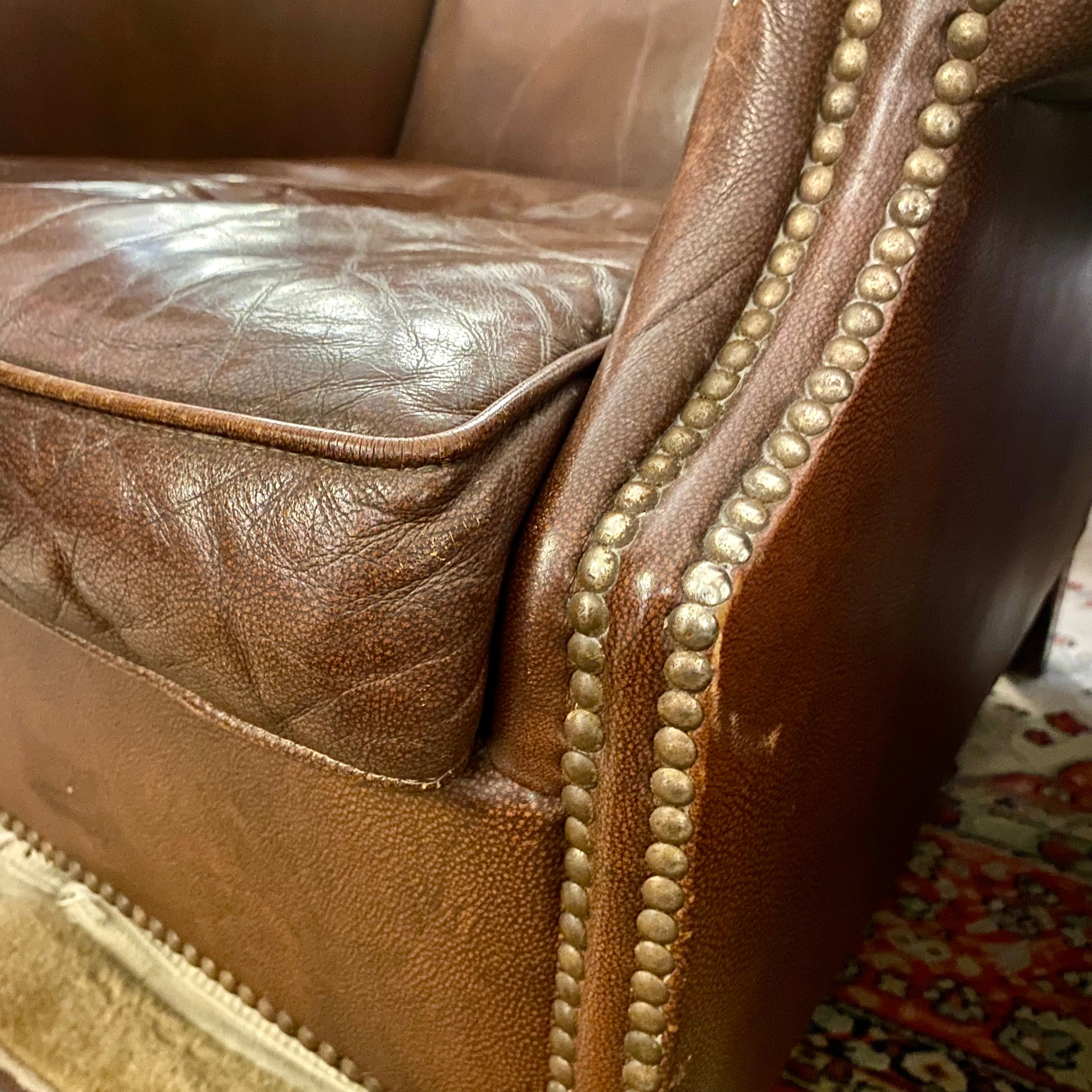 A pair of Dark Leather armchairs