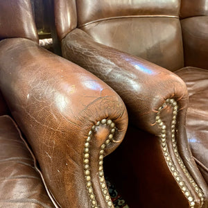 A pair of Dark Leather armchairs