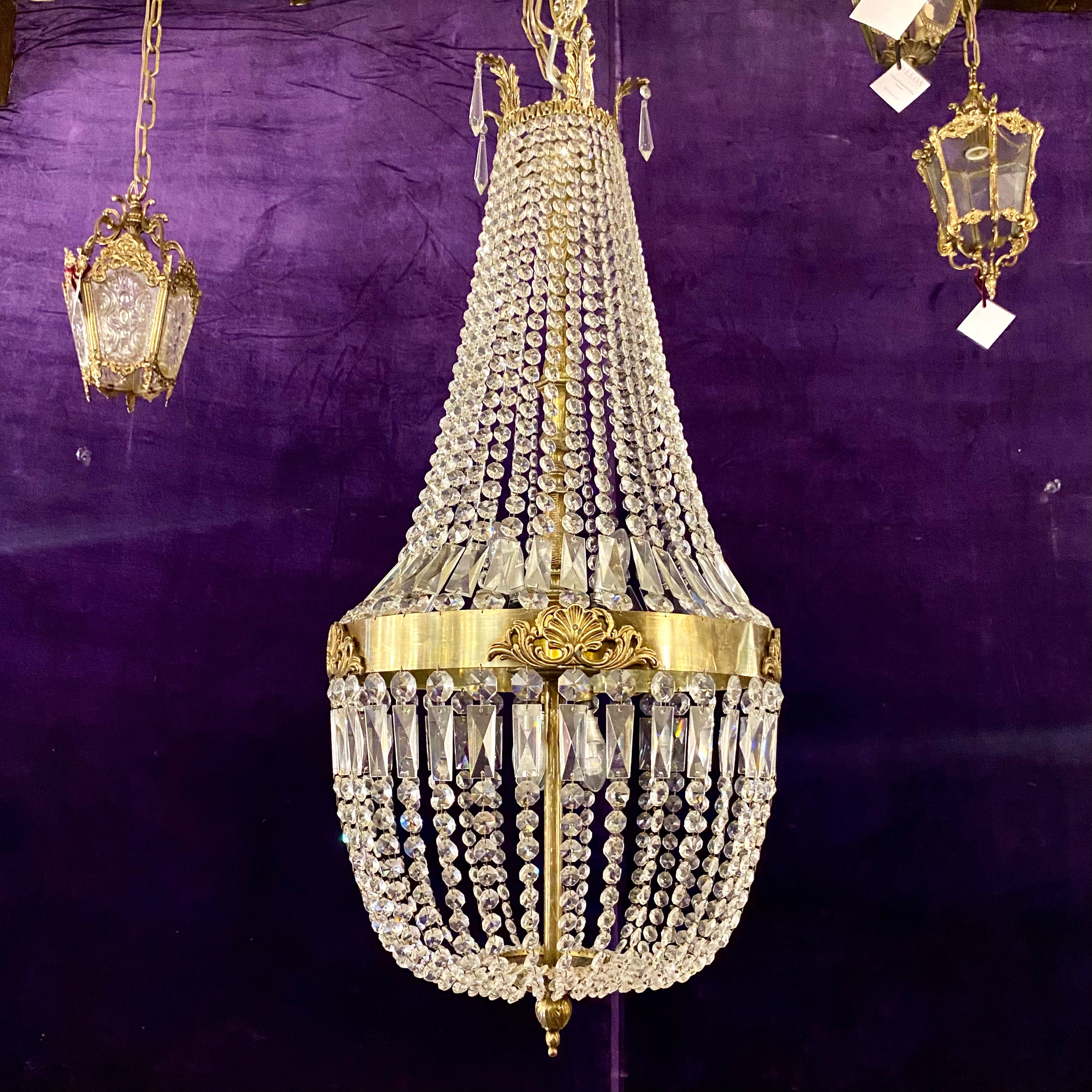 A Very Large Brass and Crystal Neoclassical Chandelier