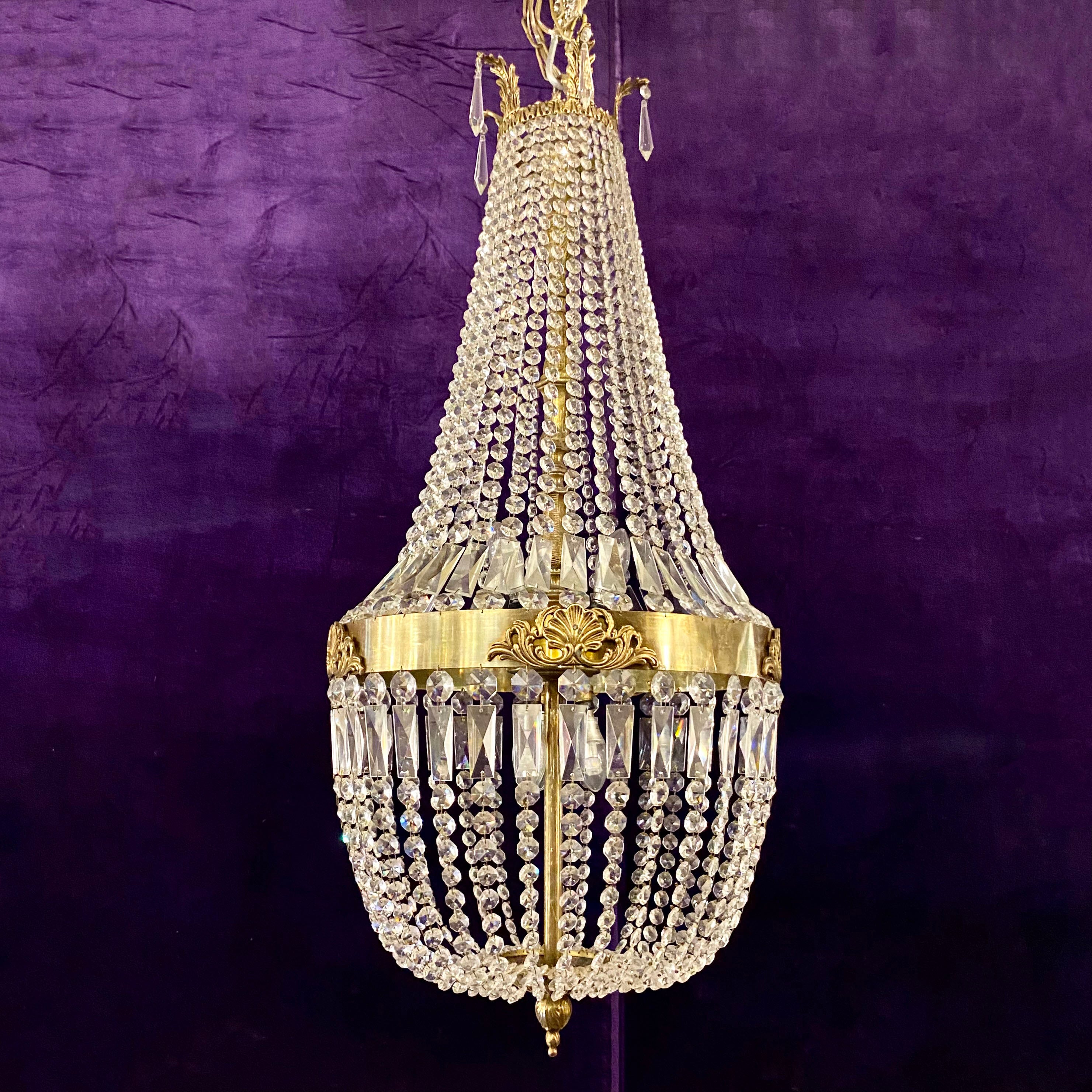 A Very Large Brass and Crystal Neoclassical Chandelier