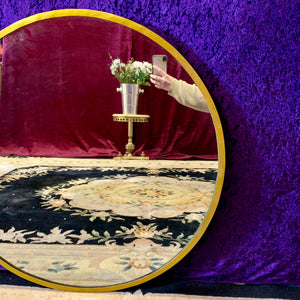 Sleek and Contemporary Round Gold Mirror