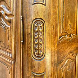 Antique Walnut Armoire with Intricate Carved Details