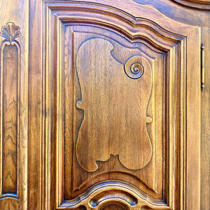 Antique Walnut Armoire with Intricate Carved Details