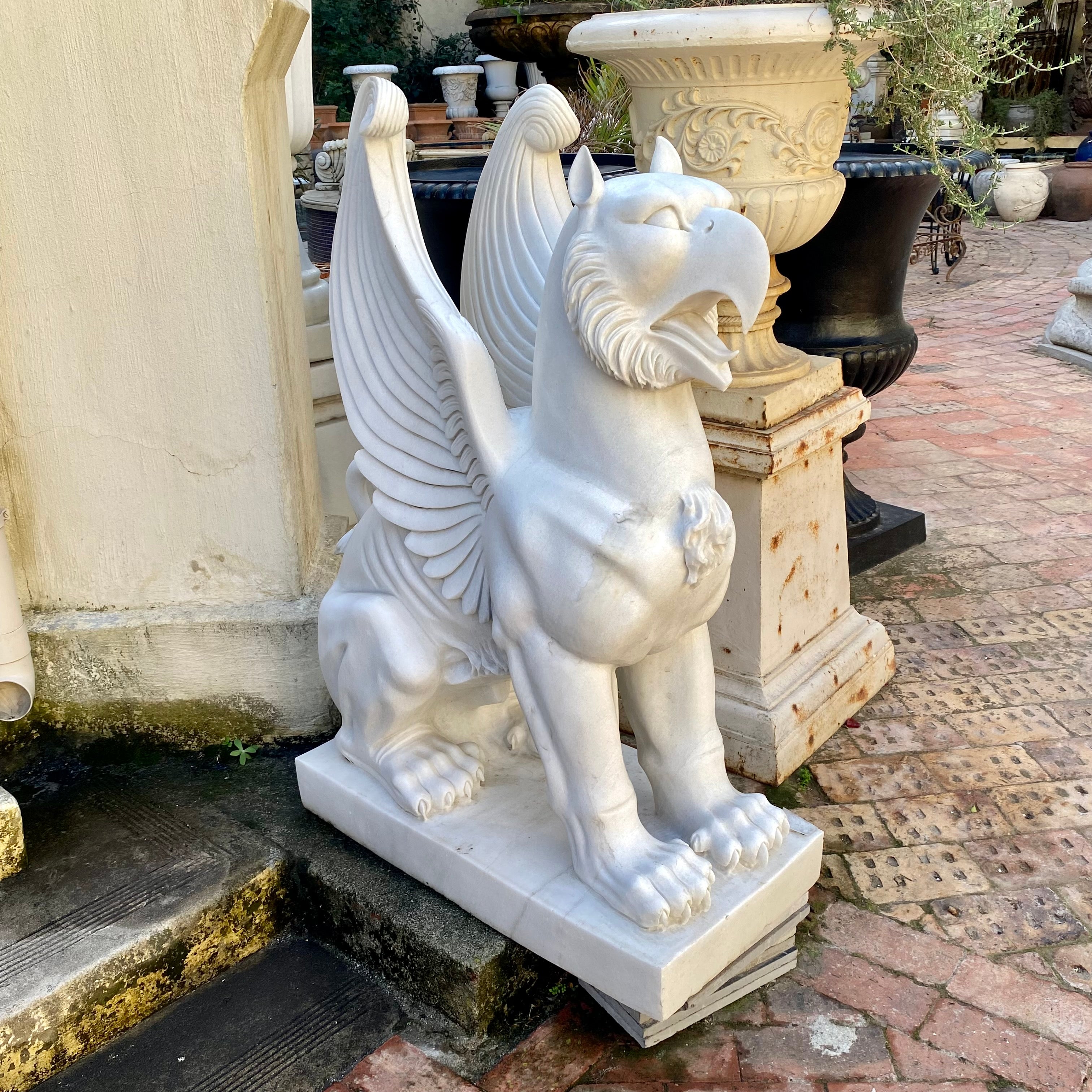 Pair of Carved White Marble Gryphons - SOLD