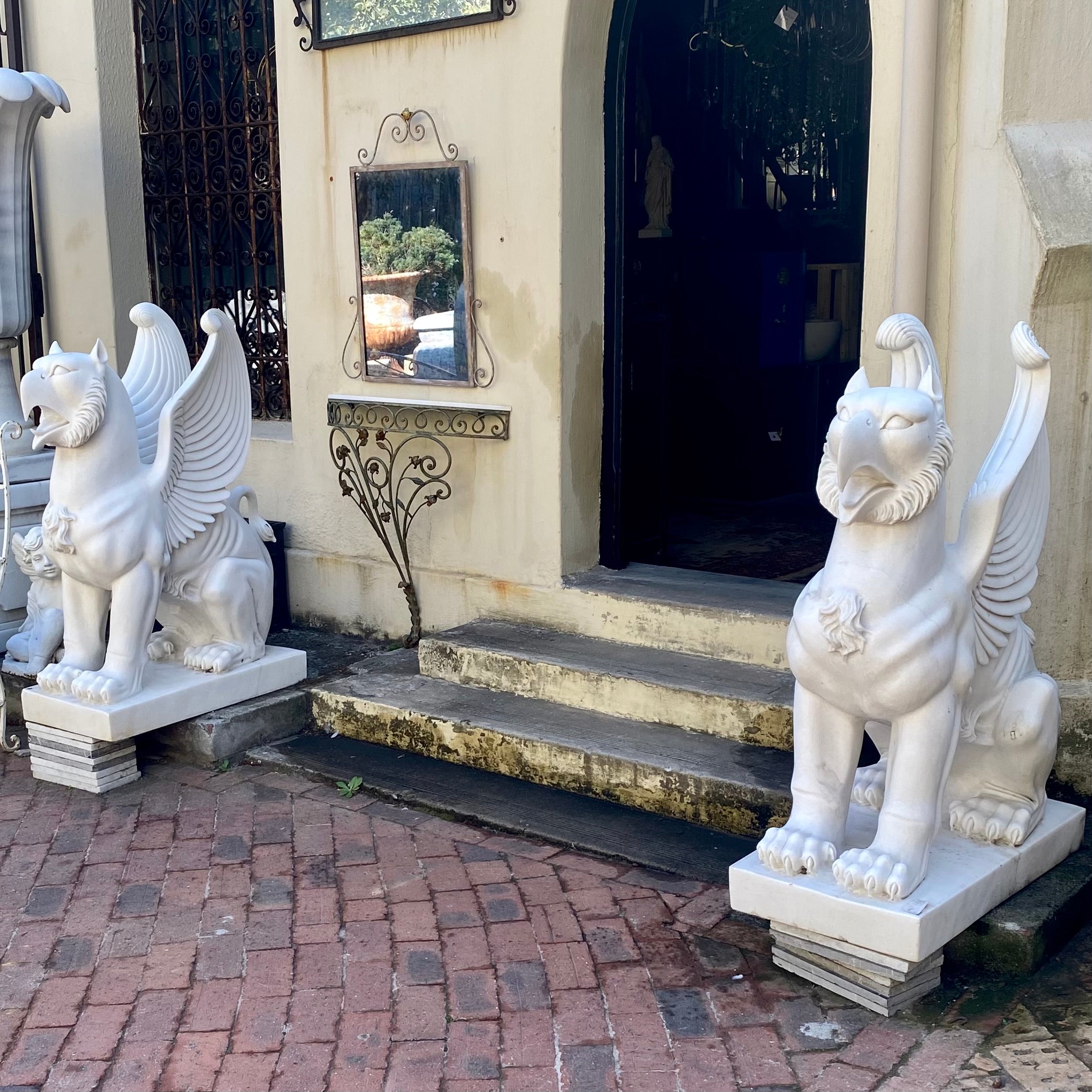 Pair of Carved White Marble Gryphons - SOLD