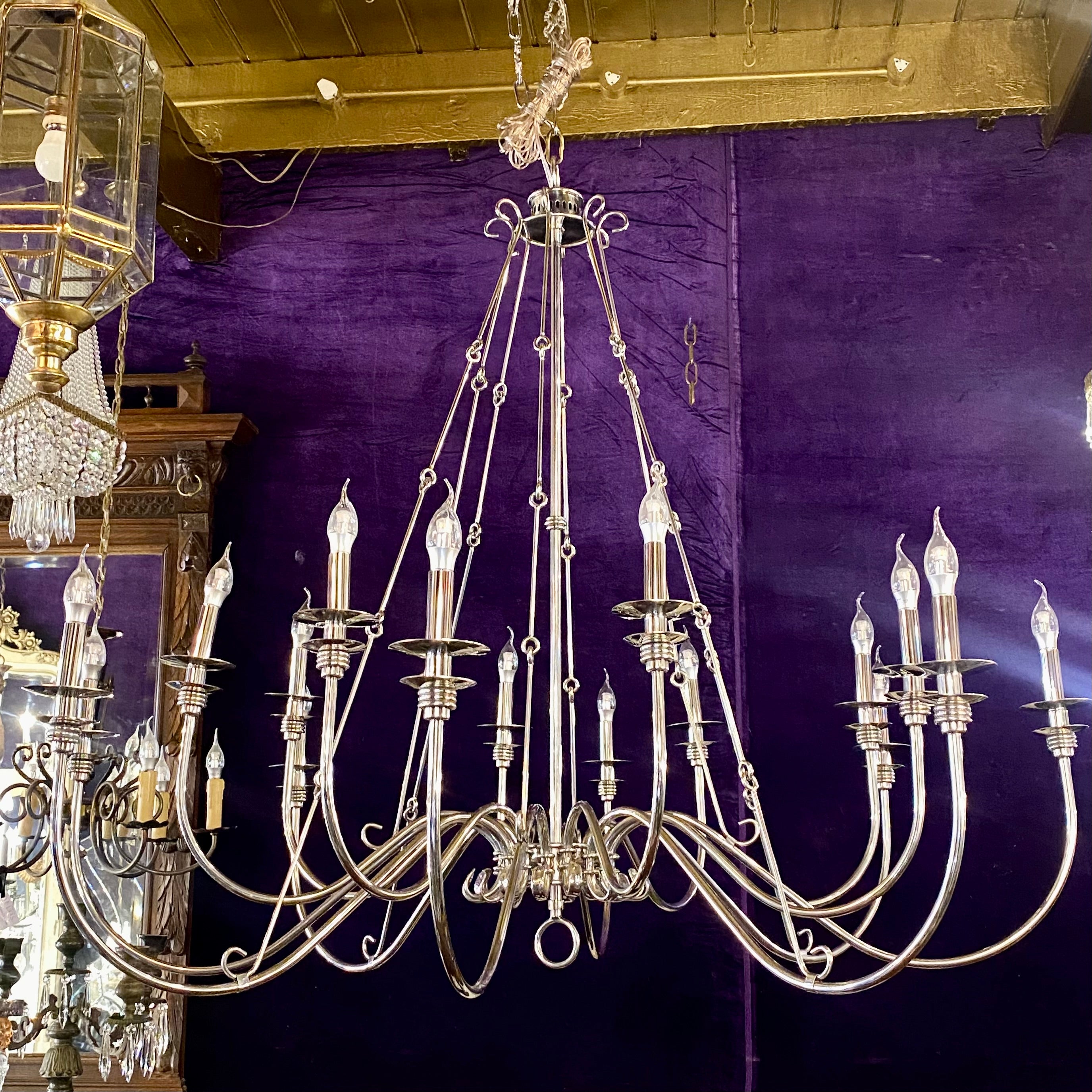 An Extremely Large Nickel Sixteen Arm Chandelier - SOLD