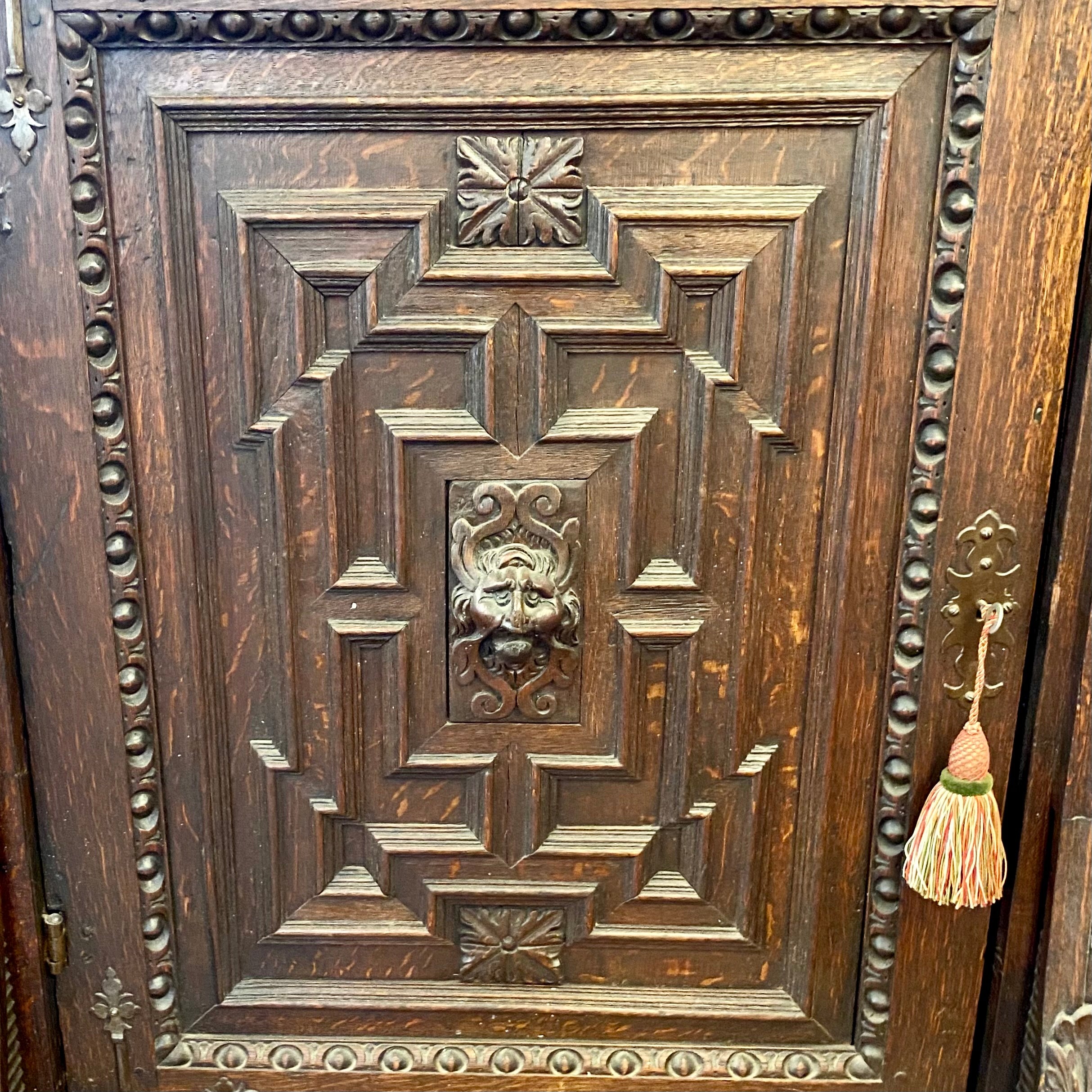 Antique French Oak Cabinet with Lion's Face Details