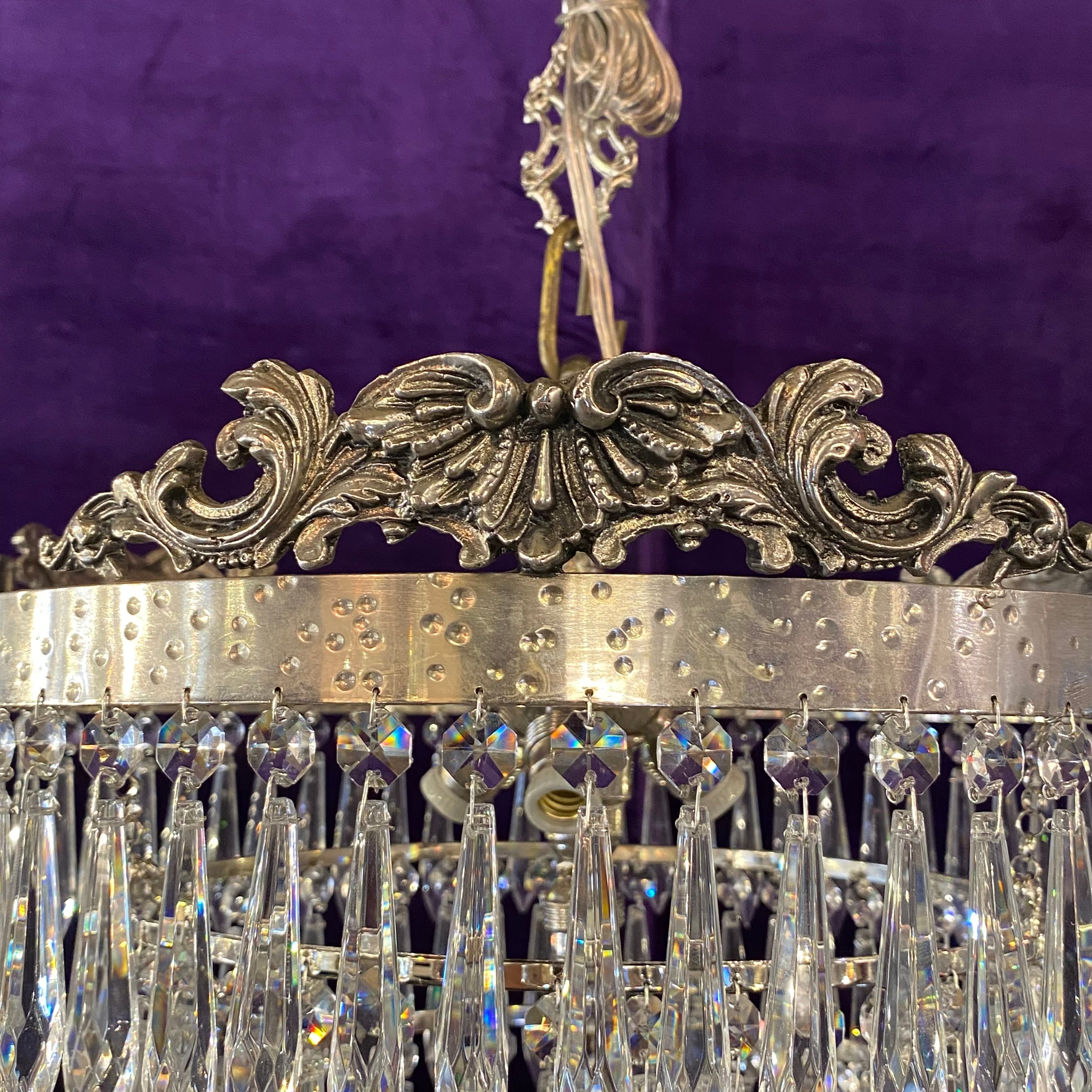 A Nickel and Crystal Waterfall Chandelier